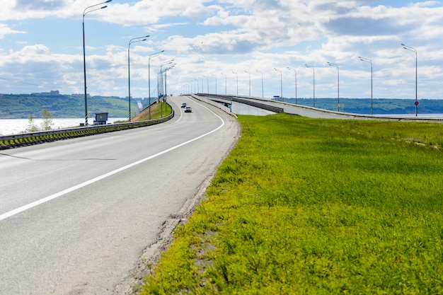 Presidential bridge in the city of Ulyanovsk from the left side of the Volga River. The 5825-meter-long bridge is the fourth largest in Russia. Sunny day.