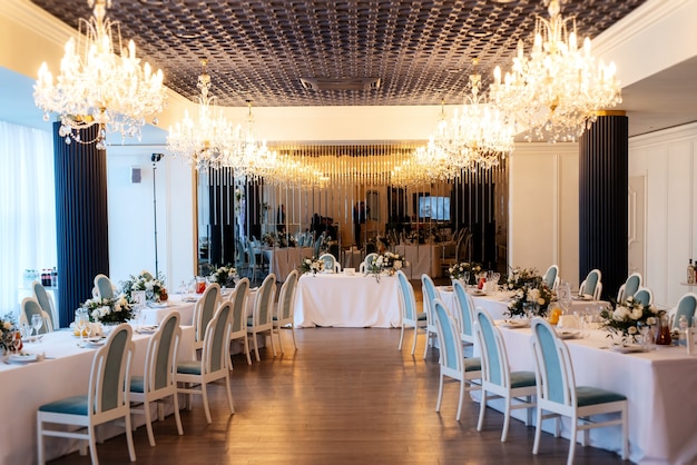 The presidium of the newlyweds in the banquet hall of the restaurant is decorated