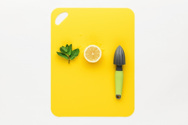 Press for lemon with lemon on a yellow background