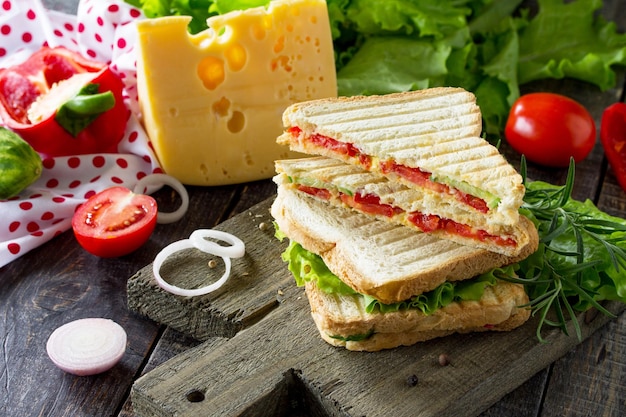 Pressed and toasted double sandwich with fresh vegetables and cheese