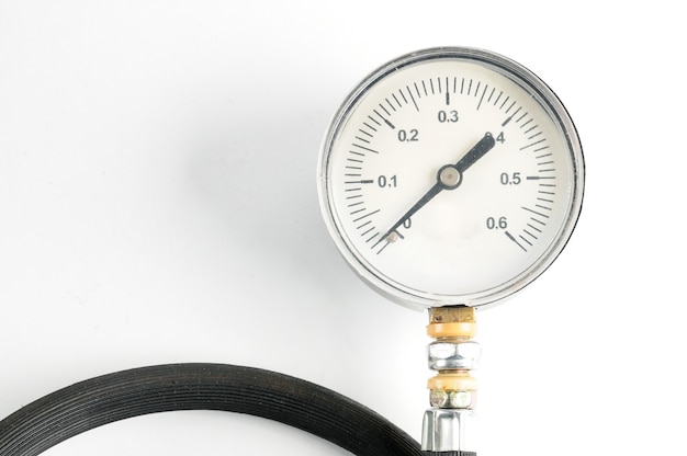 Photo pressure gauge for measuring air pressure in automobile tires close-up on an isolated white