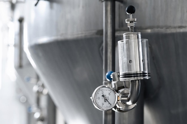 Photo pressure gauges for measuring pressure in beer tanks at modern brewery