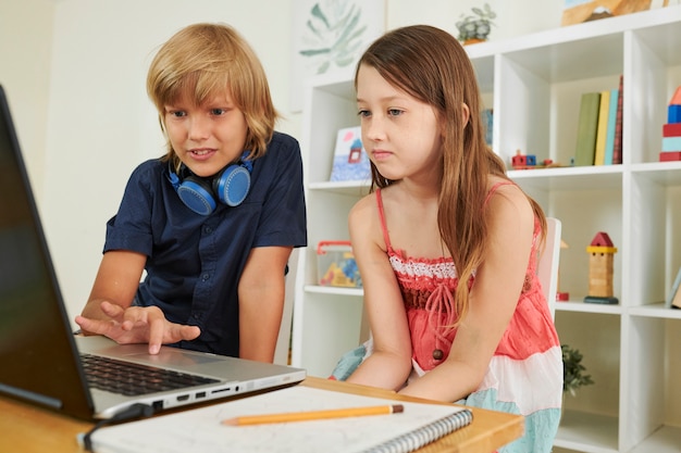 Preteen boy helping classmate