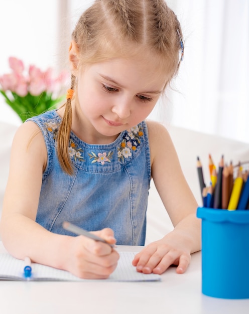 Preteen girl drawing pictures