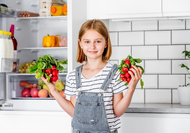 Preteen girl at kitchen