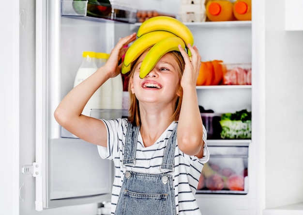 Preteen girl at kitchen