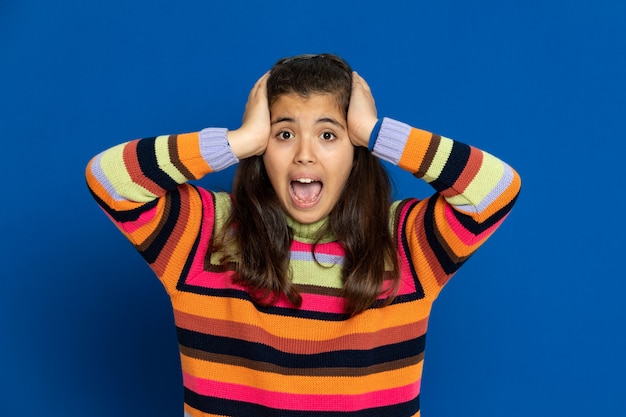 Photo preteen girl with striped jersey gesturing over blue wall