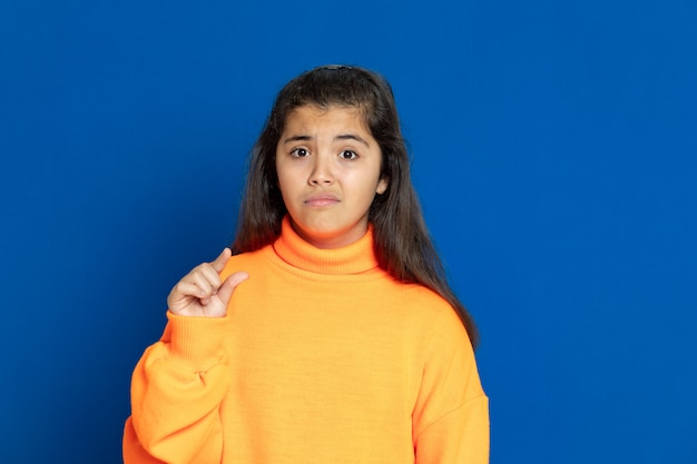 Preteen girl with yellow sweatshirt