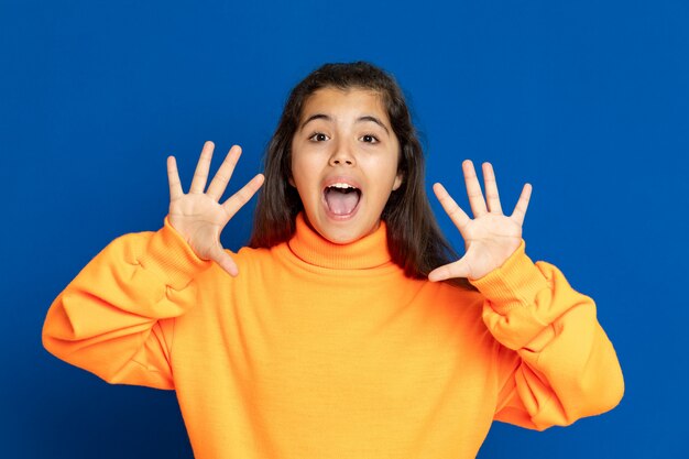 Preteen girl with yellow sweatshirt