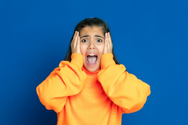 Preteen girl with yellow sweatshirt