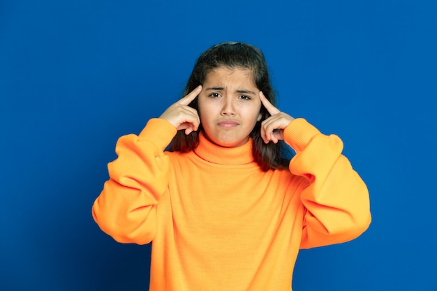 Preteen girl with yellow sweatshirt