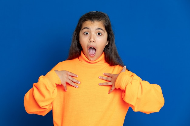 Preteen girl with yellow sweatshirt