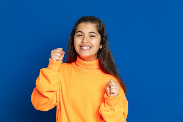 Preteen girl with yellow sweatshirt