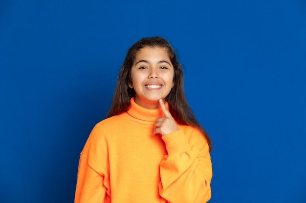 Preteen girl with yellow sweatshirt