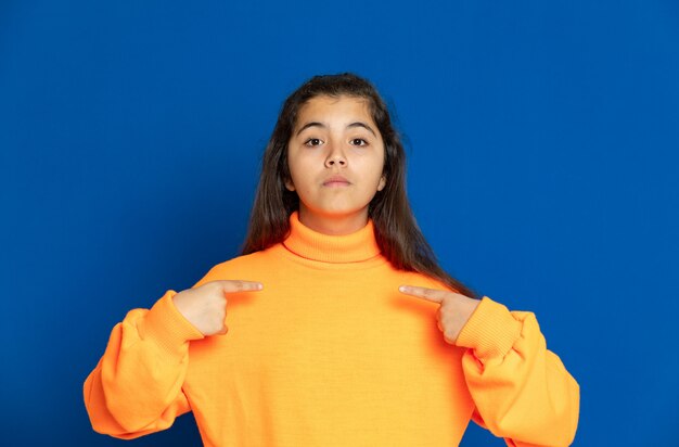 Preteen girl with yellow sweatshirt