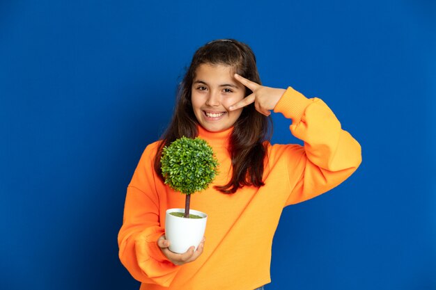 Preteen girl with yellow sweatshirt