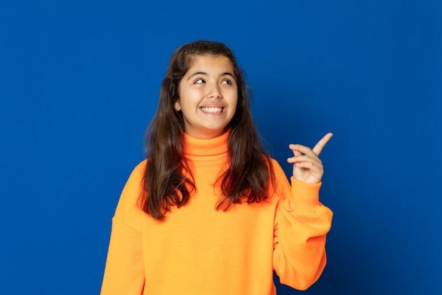 Preteen girl with yellow sweatshirt