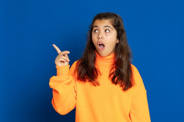 Preteen girl with yellow sweatshirt