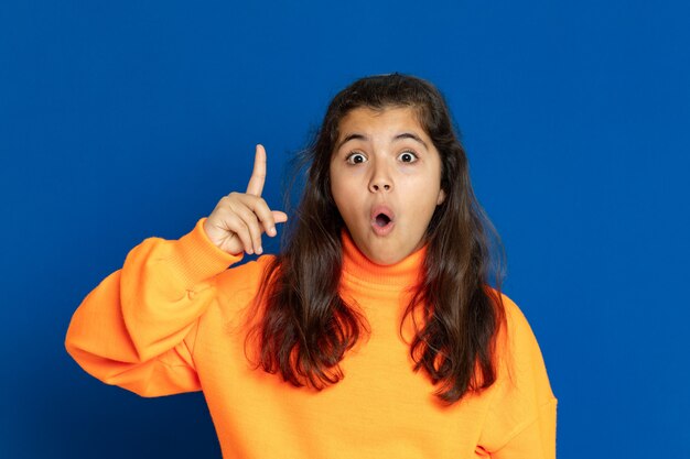 Preteen girl with yellow sweatshirt