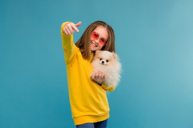 Preteen girl in yellow clothes smiling