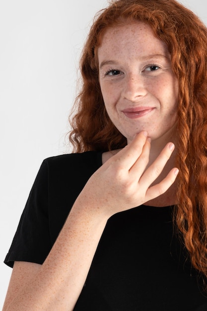 Pretty adult woman teaching sign language