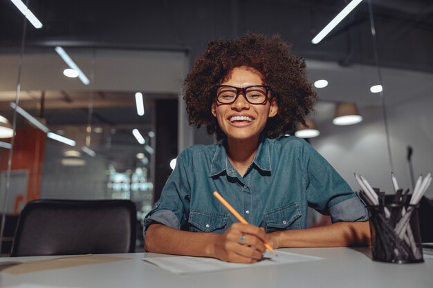 Pretty afro american woman enjoying her job