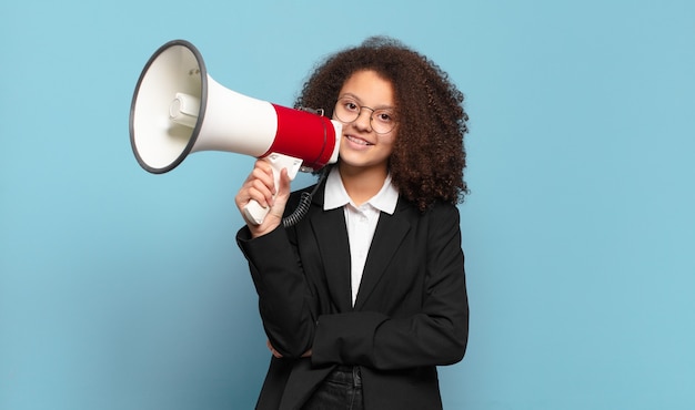 Pretty afro teenager business girl with a megaphone