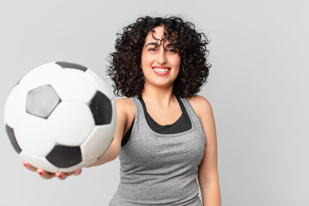 Pretty arab woman with a soccer ball.