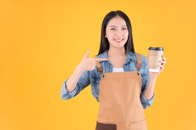 Pretty asian female smile coffee freelancer open coffee shop show present and poing to coffee cup