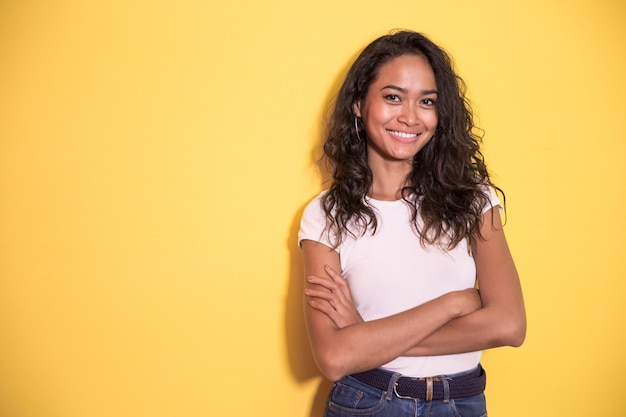 Pretty asian girl smiling with arm crossed