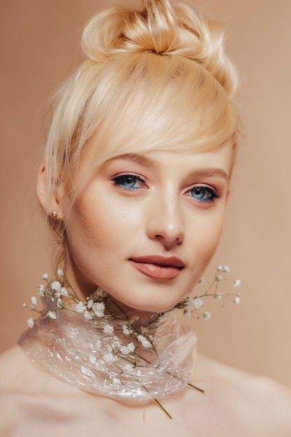 Pretty attractive girl with blond hair, fashion shooting, rose,