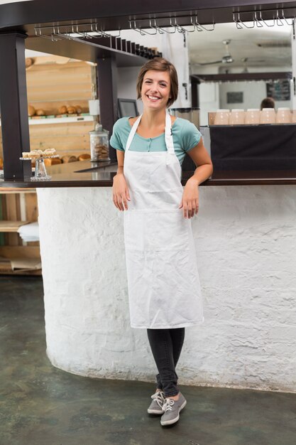 Pretty barista smiling at camera