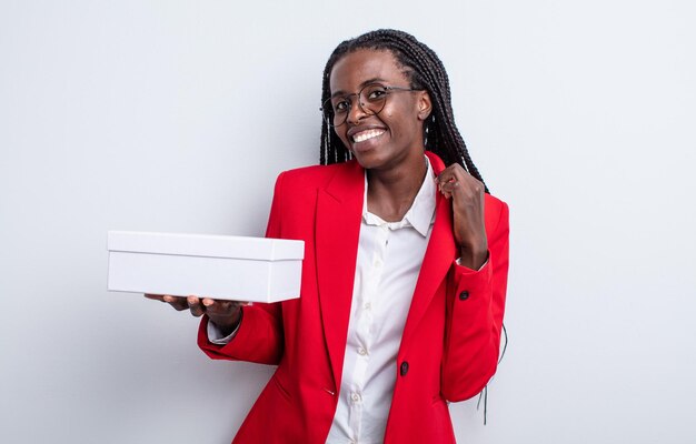 Pretty black woman looking arrogant, successful, positive and proud. businesswoman with a white box