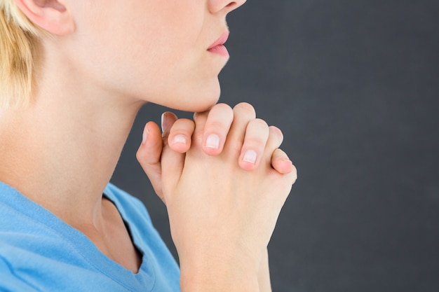 Pretty blond woman praying