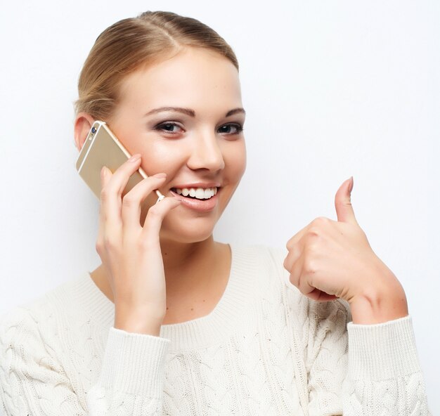 Pretty blond woman  talking on the mobile phone