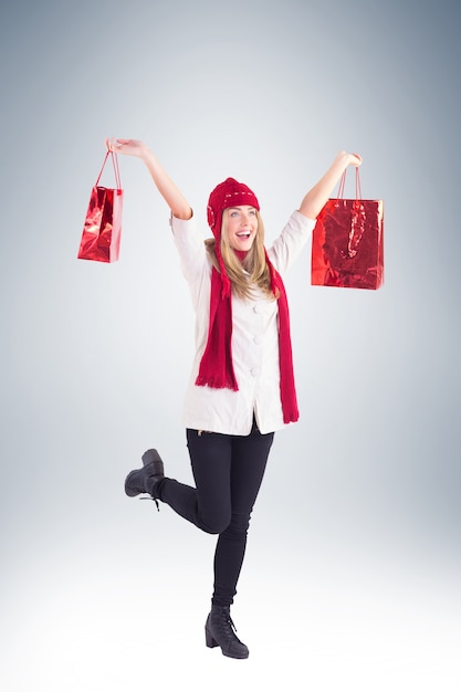 Pretty blonde carrying shopping bags