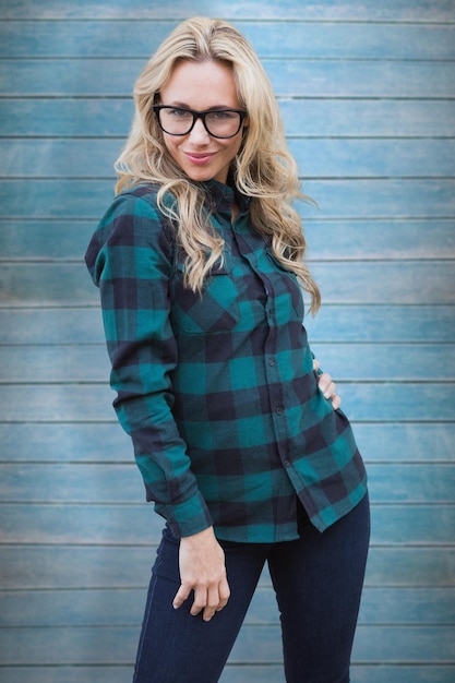 Pretty blonde hipster against wooden planks