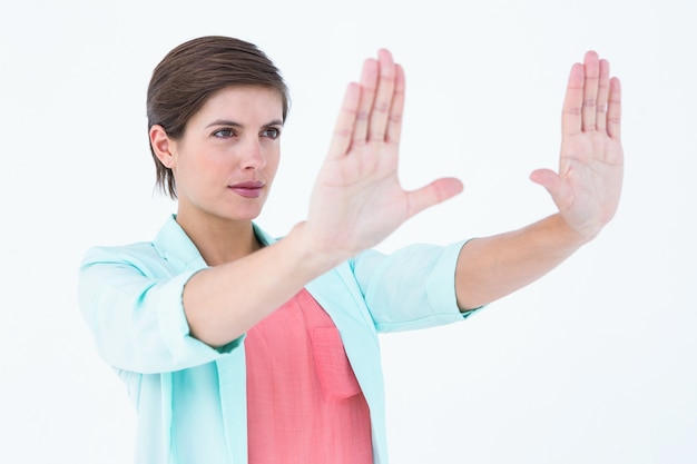 Pretty blonde making frame with her hands