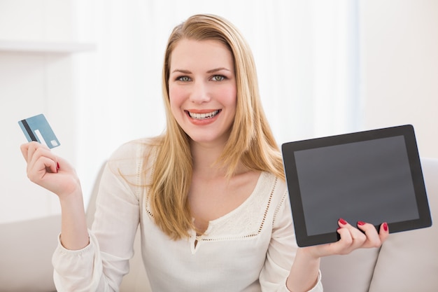 Pretty blonde shopping online with tablet