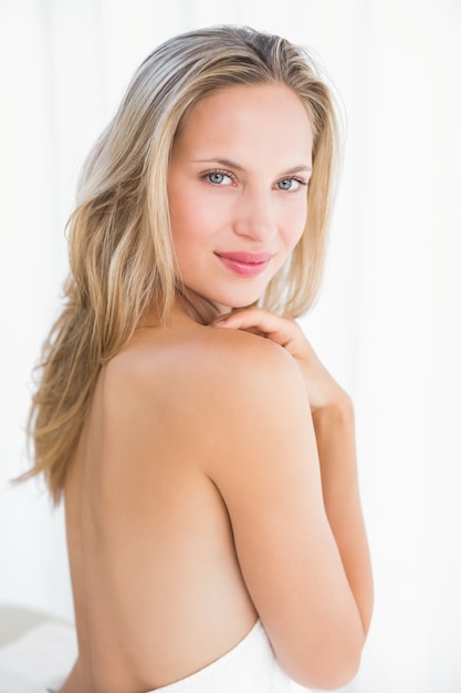 Pretty blonde sitting on massage table