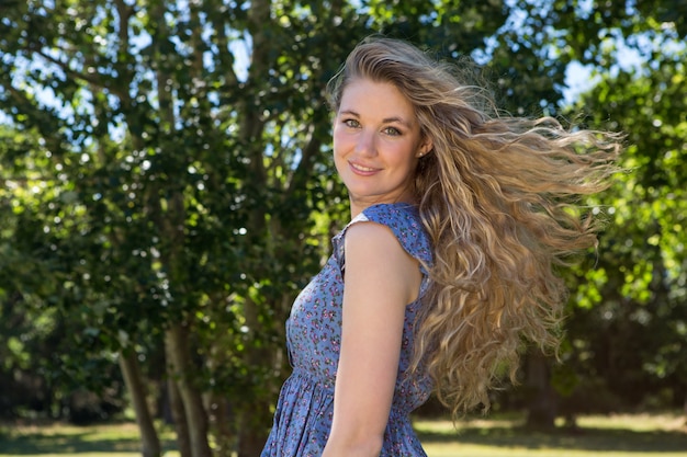 Pretty blonde smiling in the park