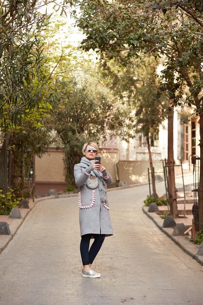 Pretty blonde taking a selfie on a spring day