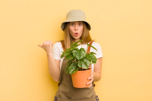 Pretty blonde woman gardener concept