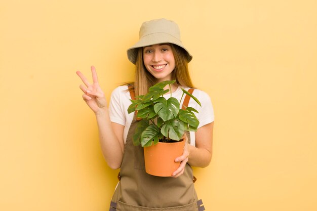 Pretty blonde woman gardener concept