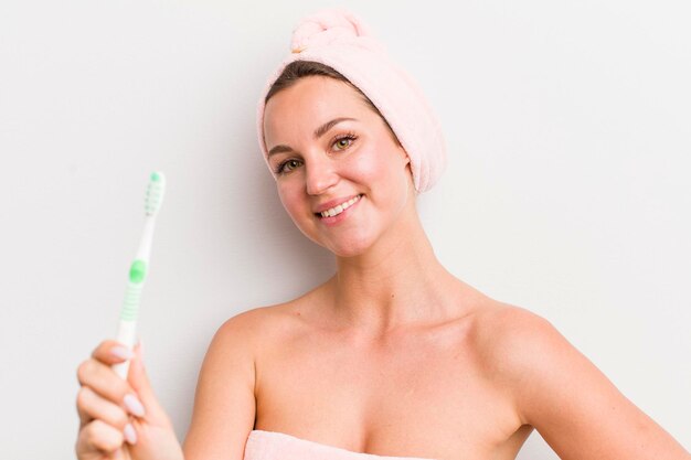 Pretty blonde woman holding a toothbrush