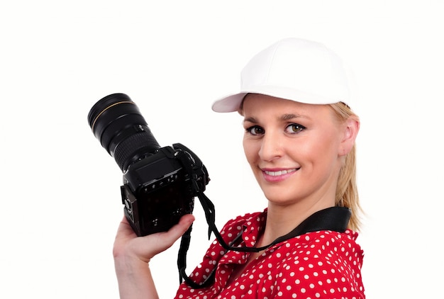 Pretty blonde woman photographer with  camera, on white