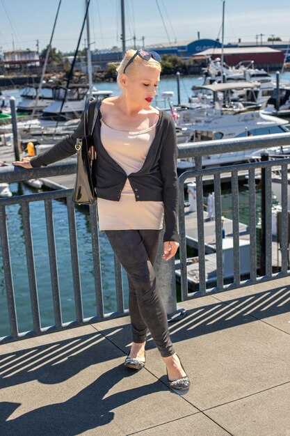 Pretty blonde woman on waterfront