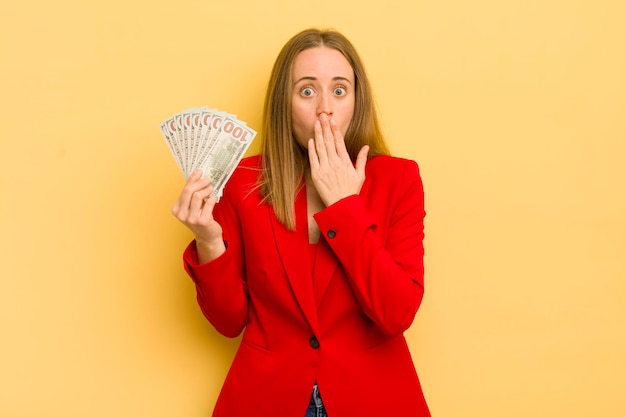 Pretty blonde woman with dollar banknotes