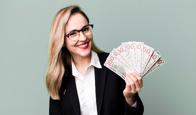 Pretty blonde woman with dollar banknotes