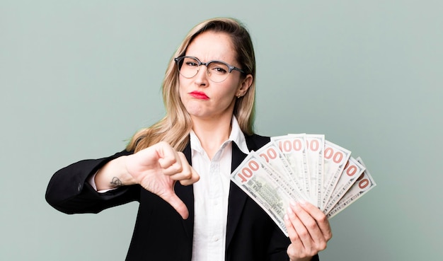 Pretty blonde woman with dollar banknotes